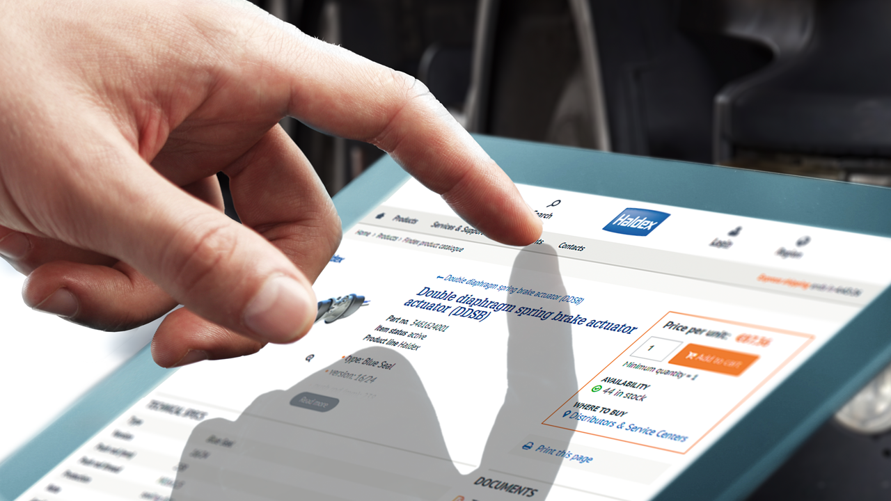 A hand navigates Haldex digital product catalog on a tablet