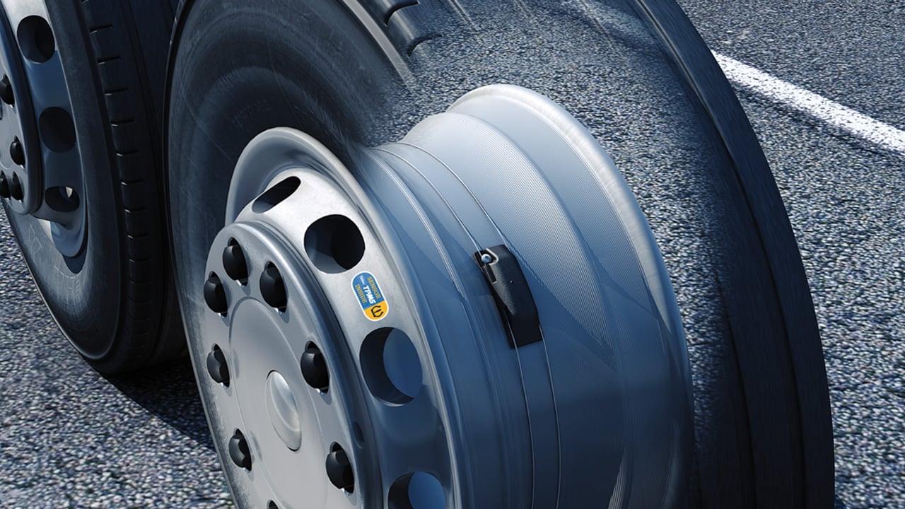 Close-up of a wheel featuring a tire pressure monitoring sensor