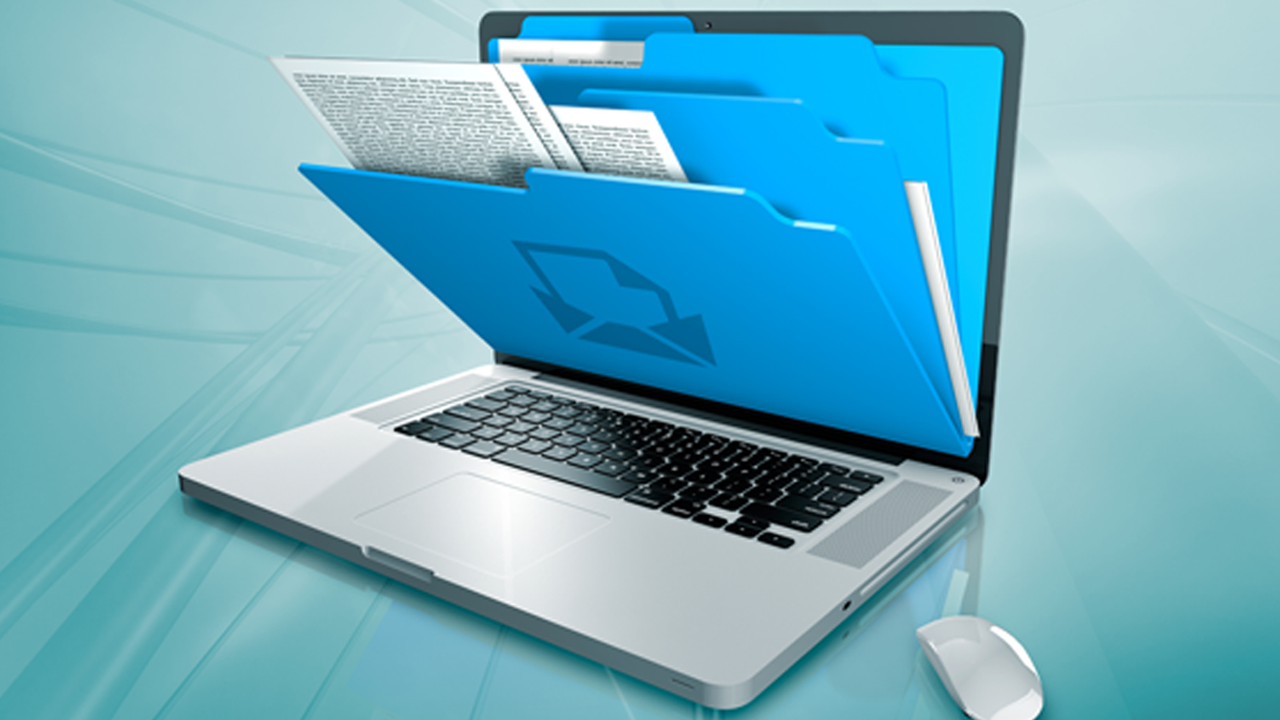 A laptop displays blue digital folders emerging from the screen